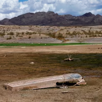 An abandoned boat sits in an area of Lake Mead that was previously underwater.