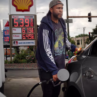 Driver fills his car with gas