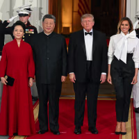 China's First Lady Peng Liyuan, left, China's leader Xi Jinping, U.S. President Donald Trump and U.S. First Lady Melania Trump  pose for a photo.