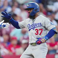 CINCINNATI, OHIO - SEPTEMBER 14: Teoscar Hernández #37 of the Los Angeles Dodgers celebrates with teammate Kyle Tucker #23 after hitting a two-run home run during the fourth inning of a baseball game against the Cincinnati Reds at Great American Ball Park on September 14, 2026 in Cincinnati, Ohio. (Photo by Jeff Dean/Getty Images)