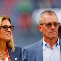DENVER, CO - SEPTEMBER 29: Owners Carrie Walton Penner and Greg Penner of the Denver Broncos walk on the field before a game against the Cincinnati Bengals at Empower Field at Mile High on September 29, 2025 in Denver, Colorado. (Photo by Justin Edmonds/Getty Images)