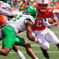 Sep 12, 2026; Stillwater, Oklahoma, USA; Oklahoma State Cowboys running back Caleb Hawkins (24) runs with the ball against the Oregon Ducks during the first quarter at Boone Pickens Stadium. Mandatory Credit: William Purnell-Imagn Images