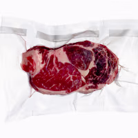 Vacuum sealed frozen cut of beef