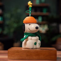 Starbucks' Snoopy glass cold cup has Woodstock perched atop the straw.