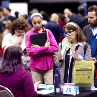 Job seekers attend a small business summit and job fair on May 12, 2026 in Chicago.