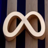 The Meta infinity symbol on the exterior facade of a building