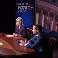 A roundtable discussion with IOWA PBS VOTE 2026 signage on the walls.