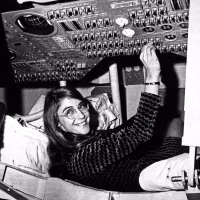 Margaret Hamilton sits in a mock-up of the Apollo command module