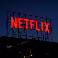 Netflix sign on the roof of an office building.