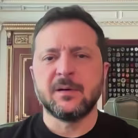 Image: Zelenskyy wearing a black t-shirt sat inside the Presidential Office.