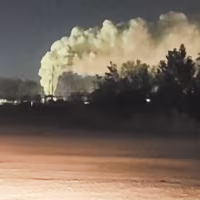 Image: Plumes of smoke rising in the distance.