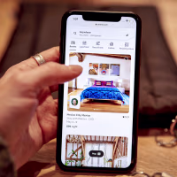 The Airbnb website on a smartphone.