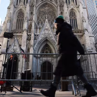 People walk by St. Patrick's Cathedral as Archbishop-designate Ronald Hicks begins the process Thursday of taking over the Archdiocese of New York, succeeding Cardinal Timothy Dolan on February 05, 2026 in New York City. 
