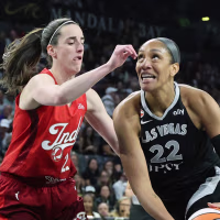 LAS VEGAS, NEVADA - OCTOBER 01: A'ja Wilson #22 of the Las Vegas Aces drives to the basket against Caitlin Clark #22 of the Indiana Fever in the first quarter of Game Three of the 2026 WNBA Playoffs first round at Michelob ULTRA Arena on October 01, 2026 in Las Vegas, Nevada. NOTE TO USER: User expressly acknowledges and agrees that, by downloading and or using this photograph, User is consenting to the terms and conditions of the Getty Images License Agreement. (Photo by Ethan Miller/Getty Images)