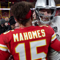 KANSAS CITY, MISSOURI - NOVEMBER 29: Patrick Mahomes #15 of the Kansas City Chiefs hugs Maxx Crosby #98 of the Las Vegas Raiders after the game at GEHA Field at Arrowhead Stadium on November 29, 2024 in Kansas City, Missouri. (Photo by Jamie Squire/Getty Images)