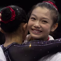 ROTTERDAM, HOLLAND: October 19: Qiyuan Qiu of China is congratulated by teammates after performing her floor routine during Women's Qualification at the Artistic Gymnastics World Championships-Rotterdam 2026 at the Rotterdam Ahoy on October 19th, 2026, in Rotterdam, the Netherlands. (Photo by Tim Clayton/Getty Images)