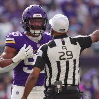 MINNEAPOLIS, MN - OCTOBER 04: Minnesota Vikings linebacker Eric Wilson (55) talks with referee Adrian Hill (29) during the first half of the NFL game between the Miami Dolphins and the Minnesota Vikings on October 4th, 2026, at U.S. Bank Stadium in Minneapolis, MN. (Photo by Bailey Hillesheim/Icon Sportswire via Getty Images)