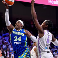 Sep 30, 2026; Arlington, Texas, USA; Dallas Wings guard Arike Ogunbowale (24) drives to the basket past Golden State Valkyries guard Kaila Charles (6) during game two of the first round for the 2026 WNBA Playoffs at College Park Center. Mandatory Credit: Jerome Miron-Imagn Images