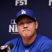 Oct 14, 2026; Los Angeles, California, USA; Los Angeles Dodgers designated hitter Shohei Ohtani at press conference prior to game three of the NLCS for the 2026 MLB Playoffs at Uniqlo Field at Dodger Stadium. Mandatory Credit: Kirby Lee-Imagn Images