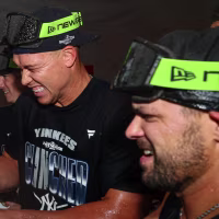 Sep 30, 2026; Bronx, New York, USA; New York Yankees outfielder Aaron Judge (99) celebrates with teammates celebrates after game two in the Wildcard round of the 2026 MLB Playoffs at Yankee Stadium. Mandatory Credit: Vincent Carchietta-Imagn Images
