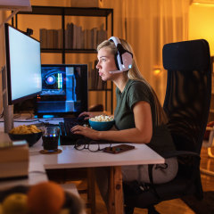 Focused young woman working on her desktop computer. Shop the best gaming headsets of 2021 including wireless gaming headsets, headsets with mics and gaming headsets that work on PC, Xbox and PlayStation.