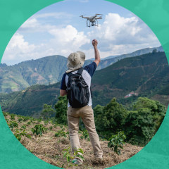 Man flying a drone in the countryside
