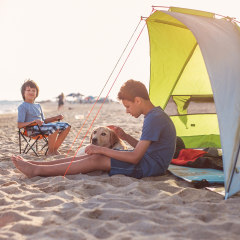Two boy's camping on the beach