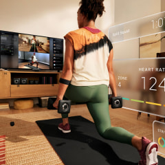 Split image of Woman working out in her home using the new Peloton Guide workout. Peloton fans have a new product to look forward to in 2021 with the Peloton Guide camera system, a $495 system that tracks strength training body movement.