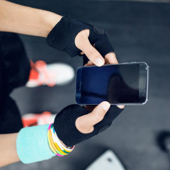 Overhead view of female athlete using smart phone at gym