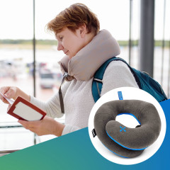 Woman at an airport with a travel pillow on her neck