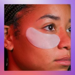 Woman wearing an under eye patch and two different eye patches