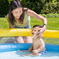 Little Baby sitting in a kiddie pool