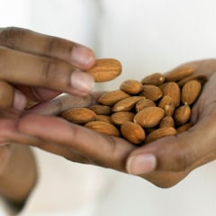Woman Eating Almonds