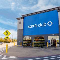 The outside of a Sam's Club storefront with blue and white signs