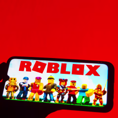 In this photo illustration the Roblox logo seen displayed on