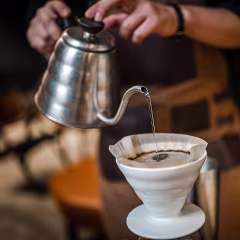 Close up of hand brewing coffee