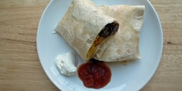 Freezer breakfast burrito (plated with salsa and sour cream)