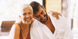 Mature woman and younger man are having fun at the spa.