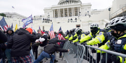 Insurrectionists loyal to President Donald Trump try to break through a police barrier, Wednesday, Jan. 6, 2021, at the Capitol in Washington. Facing prison time and dire personal consequences for storming the U.S. Capitol, some Jan. 6 defendants are trying to profit from their participation in the deadly riot, using it as a platform to drum up cash, promote business endeavors and boost social media profiles.