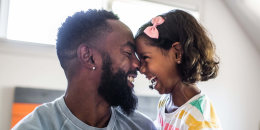 father and daughter laughing 