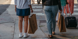 Shoppers carry Bloomingdale's bags in the Magnificent Mile shopping district in Chicago