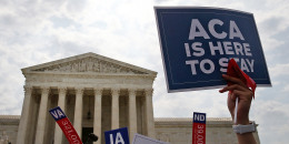 Supporters of the Affordable Care Act protest outside of the Supreme Court