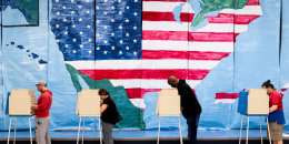 Voters fill out their ballots at a polling station in Midlothian, Va. on Nov. 7, 2023. 