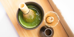 Organic Matcha in Black Bowl with Traditional Whisk