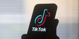 The TikTok logo on a mobile device.