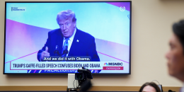 A monitor shows a video of former US President Donald Trump.