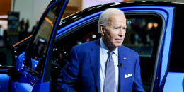 President Joe Biden gets out of a vehicle