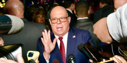 Larry Hogan speaks to reporters at an event in Arundel Mills, Md., in 2022.