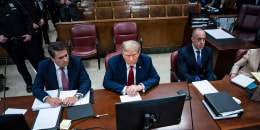 Former President Donald Trump appears with his legal team Todd Blanche and Emil Bove, right, ahead of the start of jury selection at Manhattan Criminal Court on April 15, 2024.