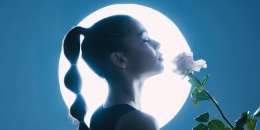 Person with white rose on moon